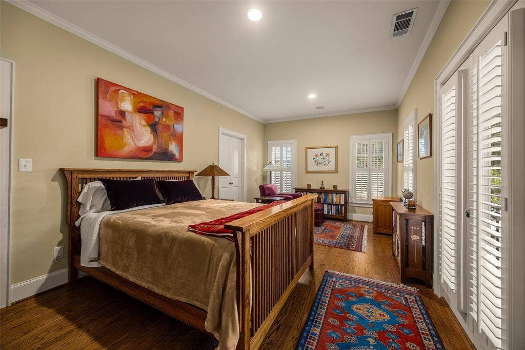 6020 Tremont Street, Dallas, TX 75214 Room featuring wood-finish flooring, recessed lighting, and white plantation shutters on the windows and French doors