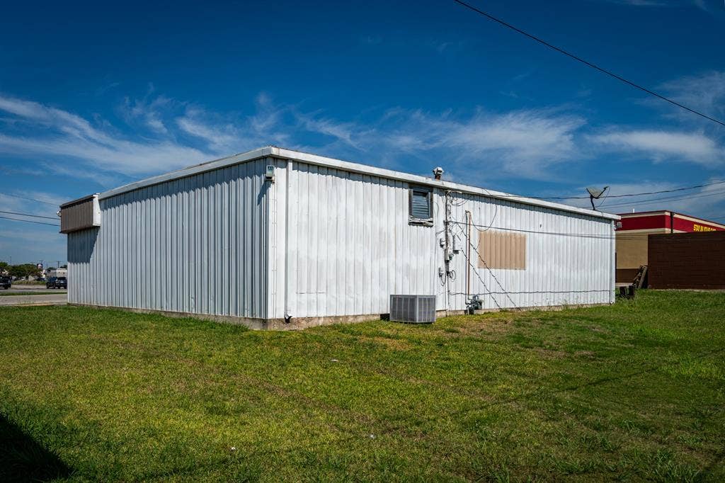 2815 Kari Lane, Greenville, TX 75402 Rear of structure. Backs up to Applebees.