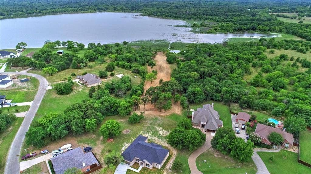10560 Lago Vista, Quinlan, TX 75474 View of property location with a large body of water and nearby suburban area