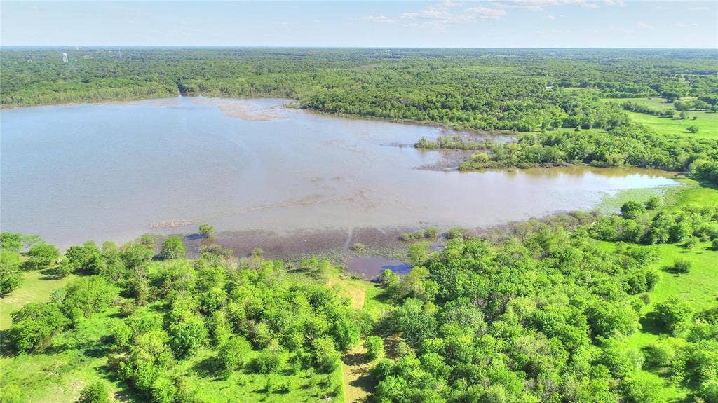 10560 Lago Vista, Quinlan, TX 75474 Aerial view of a forest and a nearby body of water