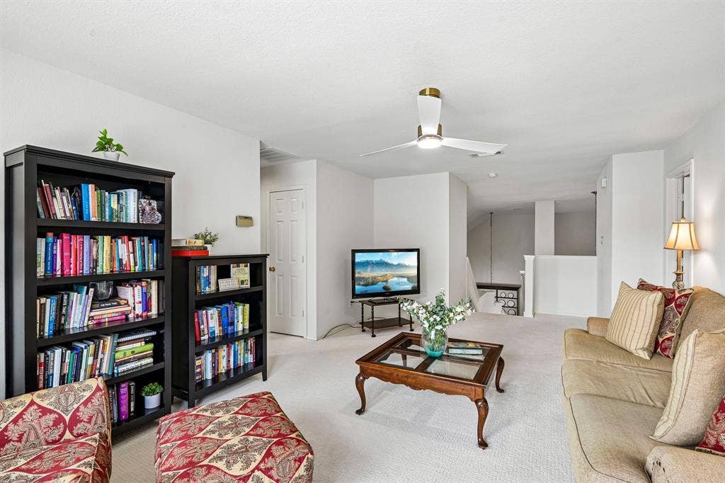 758 Livingston Drive, Allen, TX 75002 Neutral-toned carpeted flooring, white interior walls, and a ceiling fan with integrated lighting