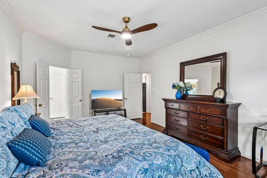 758 Livingston Drive, Allen, TX 75002 Room featuring wood-finish flooring, crown molding, and an integrated ceiling fan with light fixture