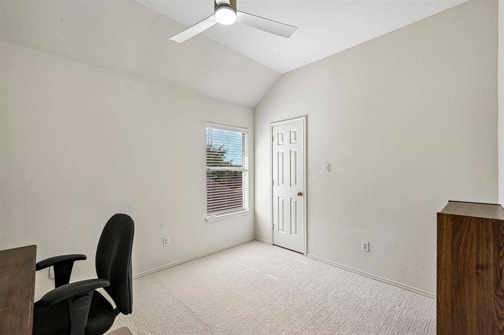 758 Livingston Drive, Allen, TX 75002 Vaulted ceiling featuring a central light-integrated ceiling fan, neutral wall-to-wall carpeting, and a single-panel interior door