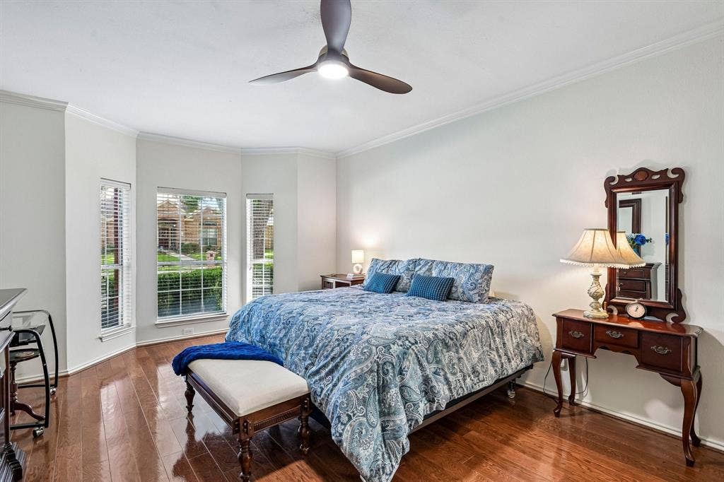 758 Livingston Drive, Allen, TX 75002 Wood-finish flooring, bay window with triple-pane windows, and three-blade ceiling fan with integrated lighting