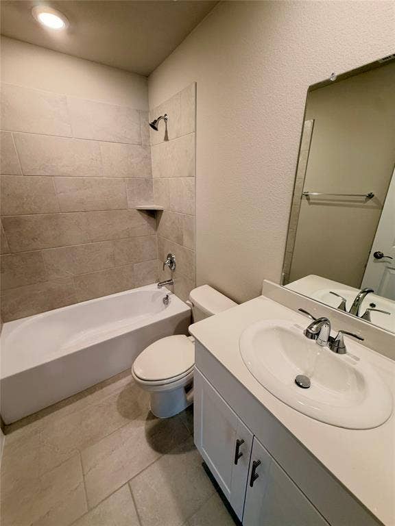 Bathroom featuring a vanity with a white solid-surface countertop, an integrated oval basin, and chrome fixtures