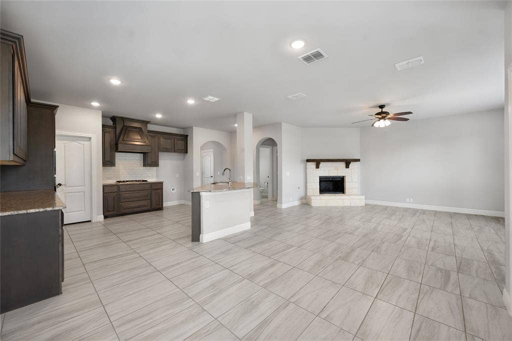 Standing in the dining area looking to the open kitchen and family room layout