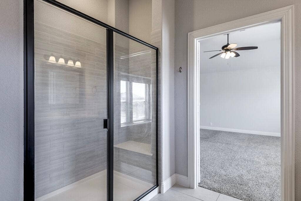 The Primary Bathroom upstairs features an oversized shower.