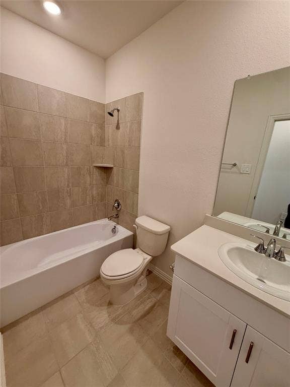 Bathroom featuring white cabinetry, solid-surface countertop with integrated basin, shower-tub combination with tile surround, and tile flooring