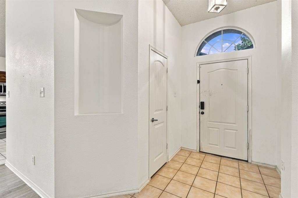 High ceilings and natural light begin upon entering .