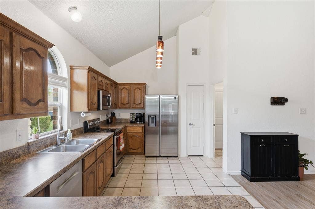 Notice the high ceilings, natural light, ample prep space and storage!  A place for everything makes entertaining and quick bites easy!   virtually staged