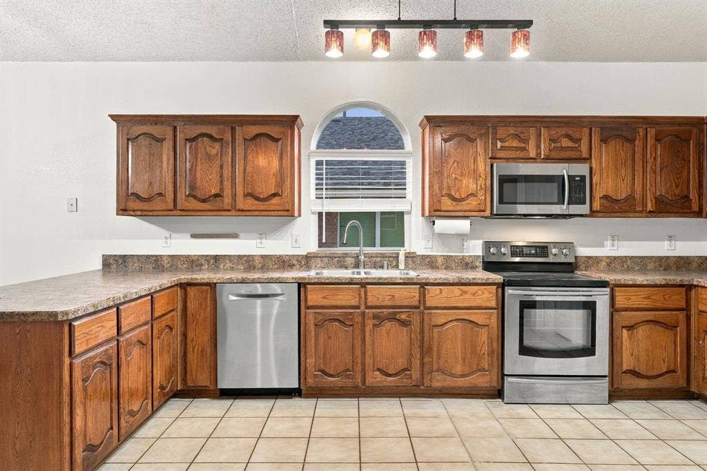Natural light, stainless steel appliances and ample counter space makes this area ideal for entertaining or grabbing a quick bite.