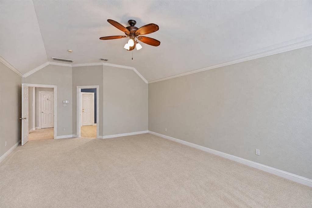 604 Barkley Drive, McKinney, TX 75071 Vaulted ceilings featuring crown molding and a multi-blade ceiling fan with integrated lighting