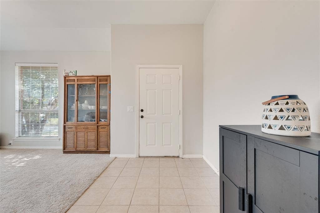721 Honeysuckle Way, DeSoto, TX 75115 Entryway that opens into the formal dining area that can also be used as a sitting area!