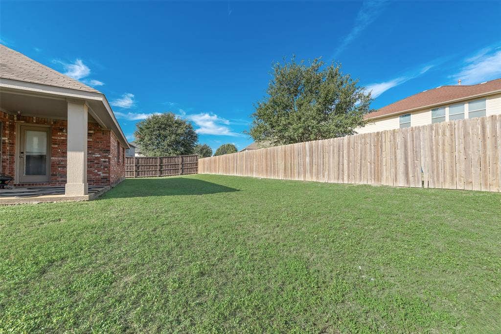 721 Honeysuckle Way, DeSoto, TX 75115 The HUGE yard is perfect for entertaining! It also features a covered patio, perfect for grilling!