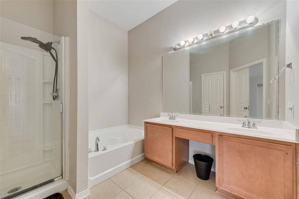 721 Honeysuckle Way, DeSoto, TX 75115 Master Bathroom featuring a dual-sink vanity and a separate shower and tub!