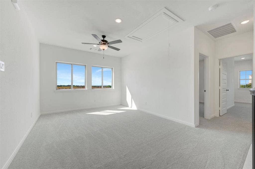 3469 Jersey Drive, Midlothian, TX 76065 Room featuring neutral carpeting, recessed lighting, dual windows, and a ceiling fan with integrated light fixture
