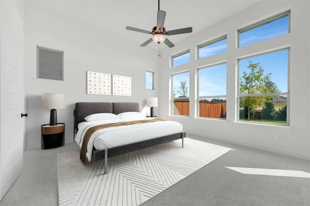 3469 Jersey Drive, Midlothian, TX 76065 High ceilings featuring expansive windows with transom glass, neutral carpeting, and a multi-blade ceiling fan with integrated light fixture