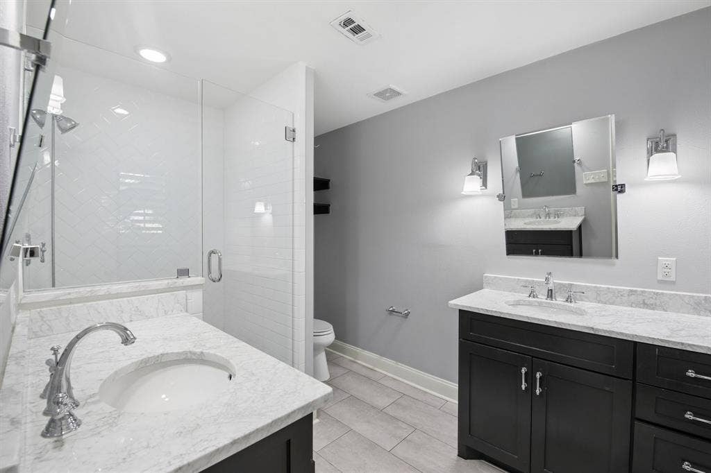 9935 Milltrail Drive, Dallas, TX 75238 ensuite bath. dual vanities & sinks
