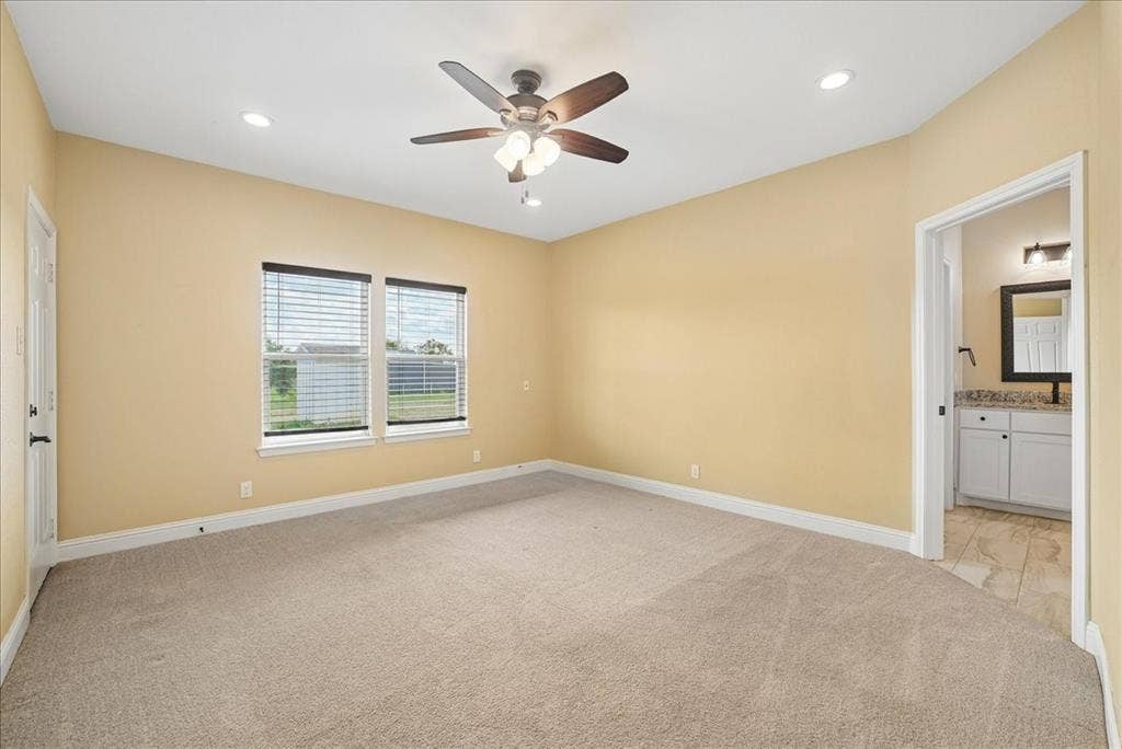 9060 Mitchell Bend Court, Granbury, TX 76048 Neutral-toned interior room featuring carpeted flooring, a ceiling fan with integrated lighting, recessed lighting, and double-paned windows