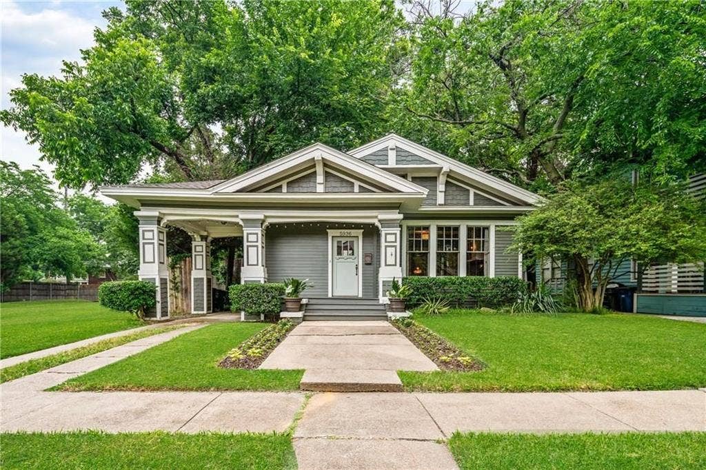 5936 Bryan Parkway, #B, Dallas, TX 75206 Photo of the main house - NOT FOR RENT - Craftsman-style residence featuring lap siding, shake shingle accents, a covered front porch with square columns, and a concrete walkway