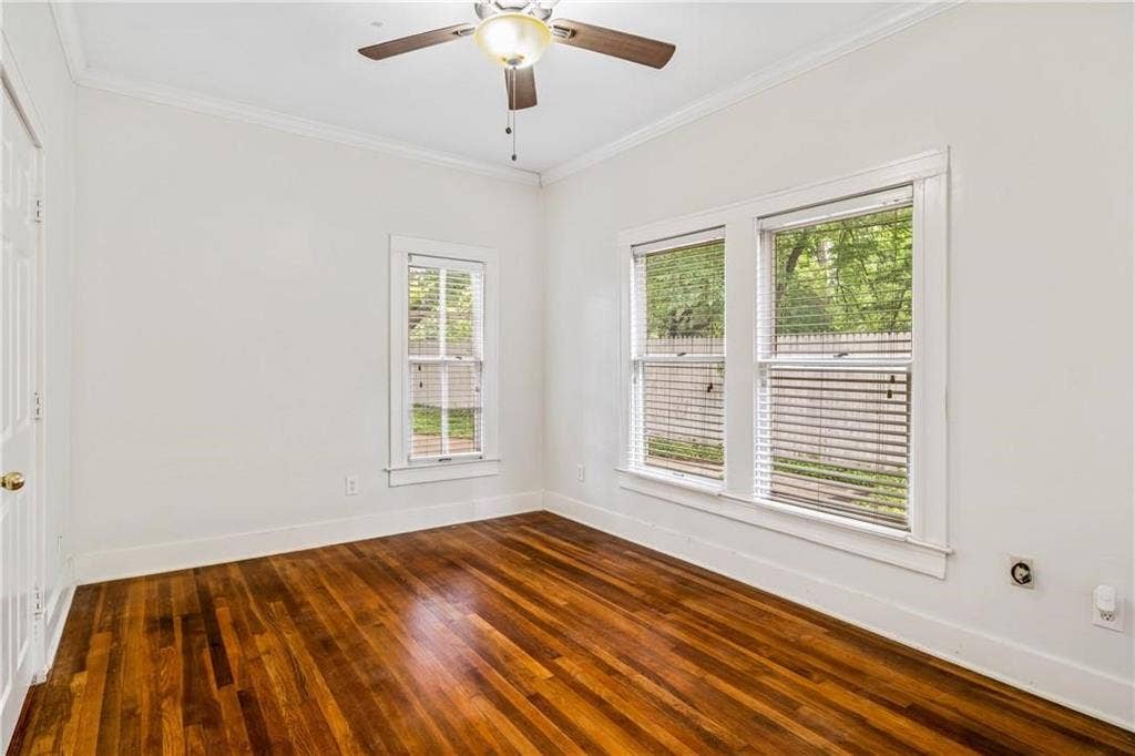 5936 Bryan Parkway, #B, Dallas, TX 75206 Hardwood flooring, crown molding, multi-pane windows, and a central ceiling fan with integrated lighting