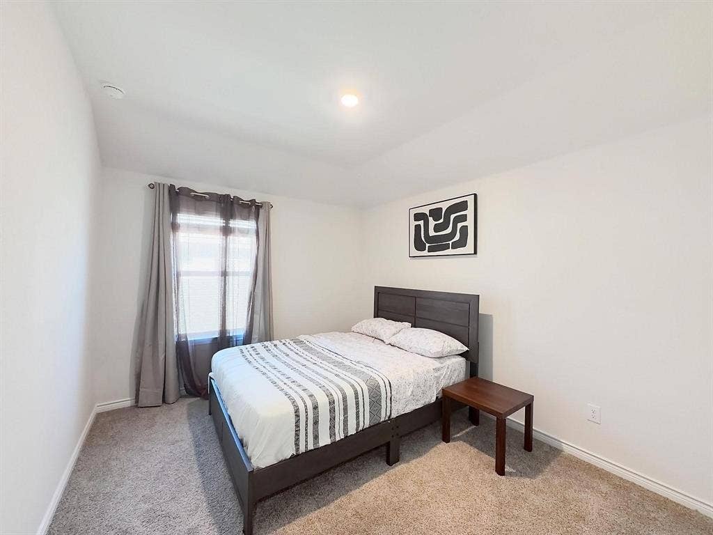 7400 Seton Place, McKinney, TX 75071 Neutral-toned wall-to-wall carpeting, recessed ceiling lighting, and a single-pane window with a neutral finish