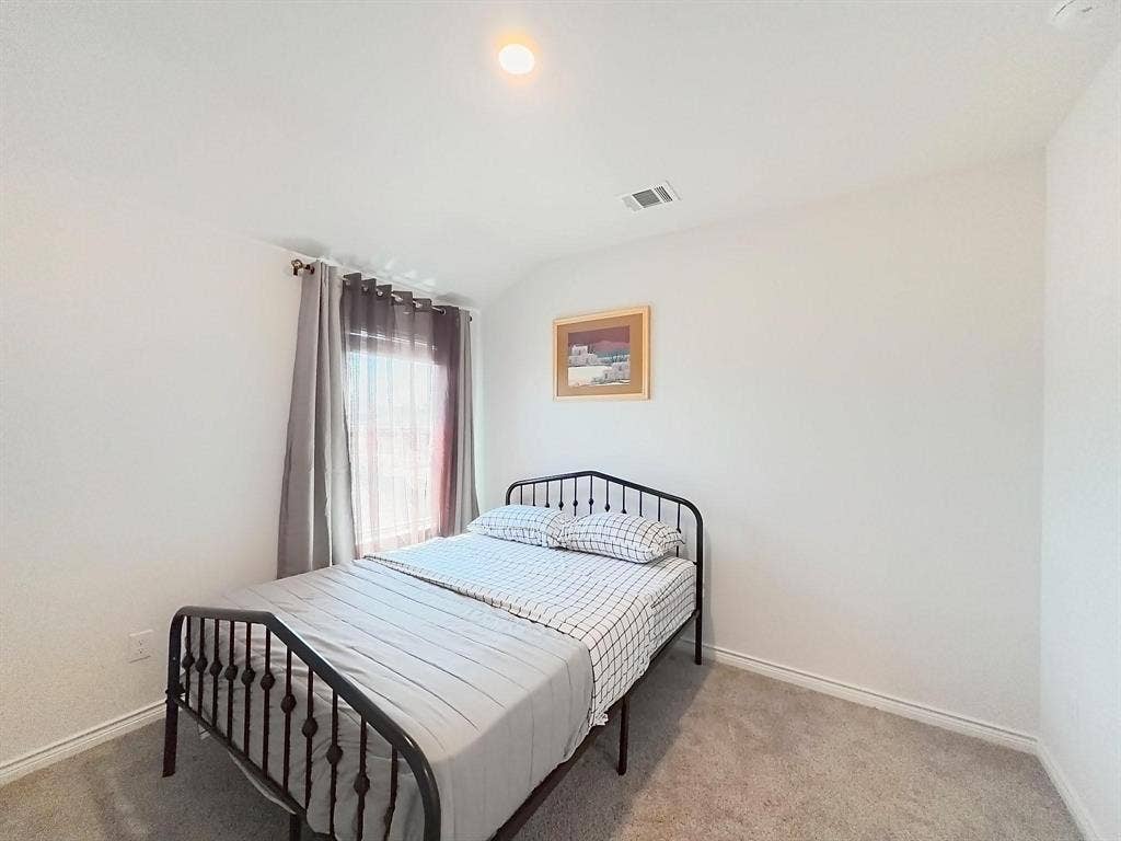 7400 Seton Place, McKinney, TX 75071 Neutral wall tones, carpeted flooring, and a single window with natural light