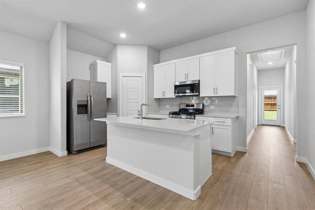2720 Auburn Court, Princeton, TX 75407 Kitchen in the Cypress home plan - REPRESENTATIVE PHOTO