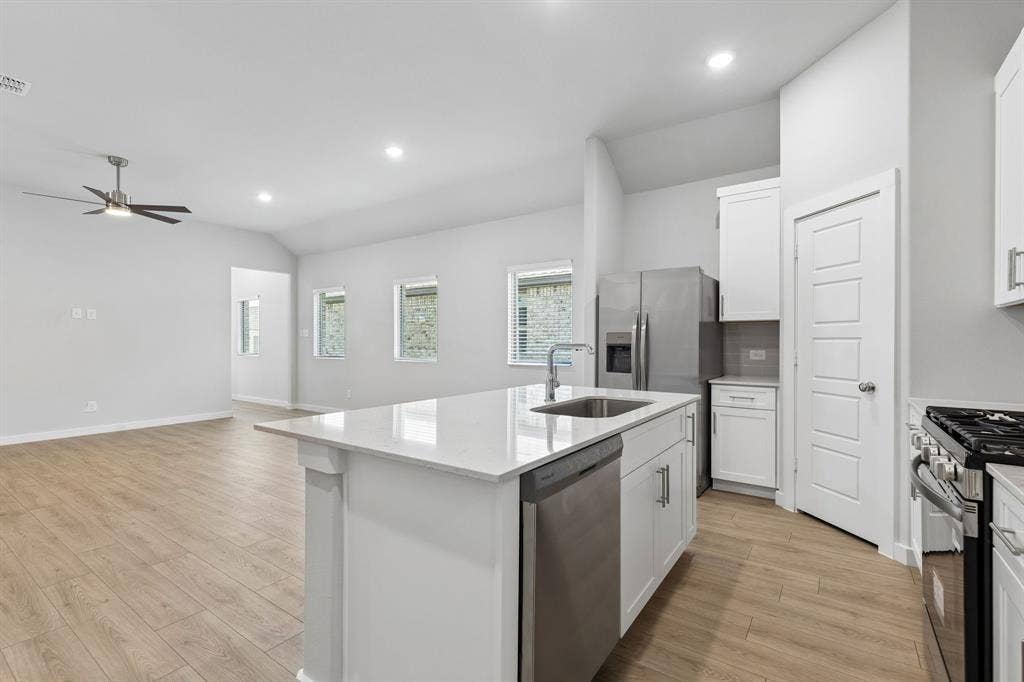 2720 Auburn Court, Princeton, TX 75407 Kitchen in the Cypress home plan - REPRESENTATIVE PHOTO