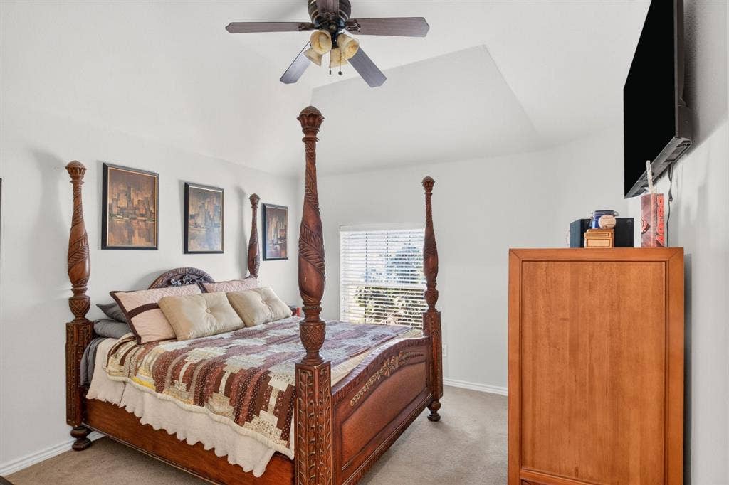 10657 Coach House Lane, Frisco, TX 75035 Secondary bedroom with a ceiling fan and space for furnishings.