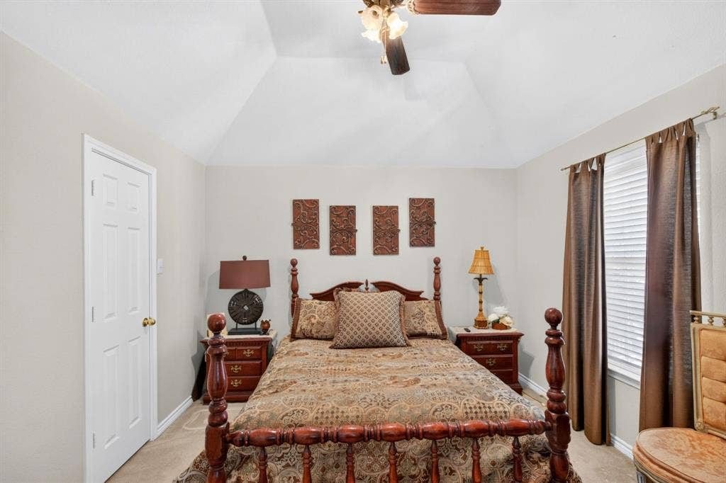 10657 Coach House Lane, Frisco, TX 75035 Secondary bedroom with a ceiling fan and natural light.