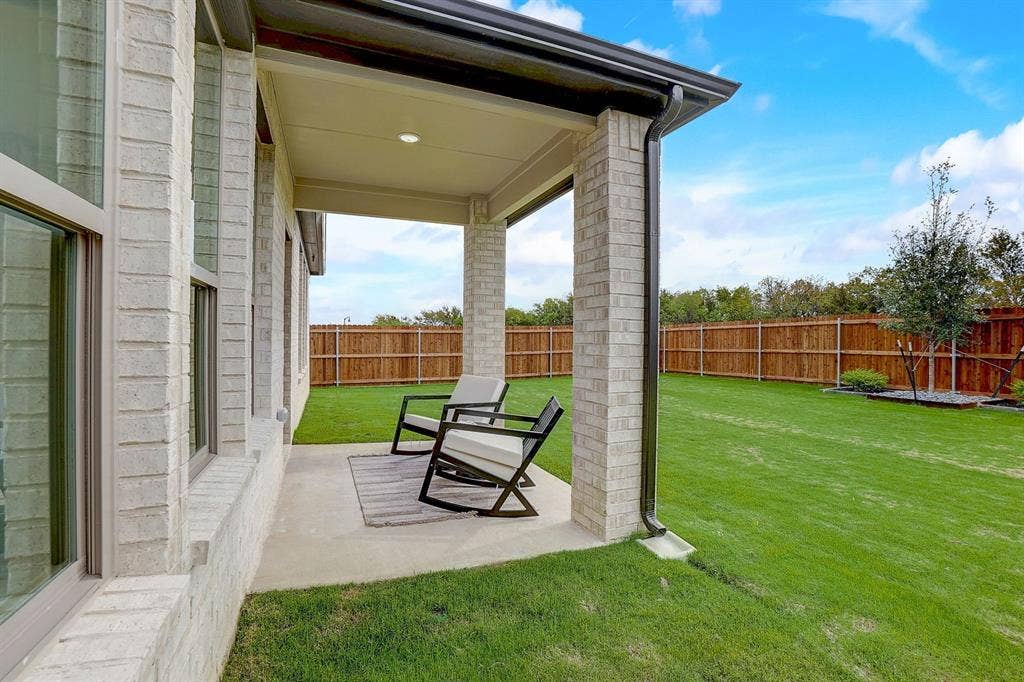 348 Lacy Oak Lane, Waxahachie, TX 75165 Covered Patio in the Stanley II home plan - REPRESENTATIVE PHOTO
