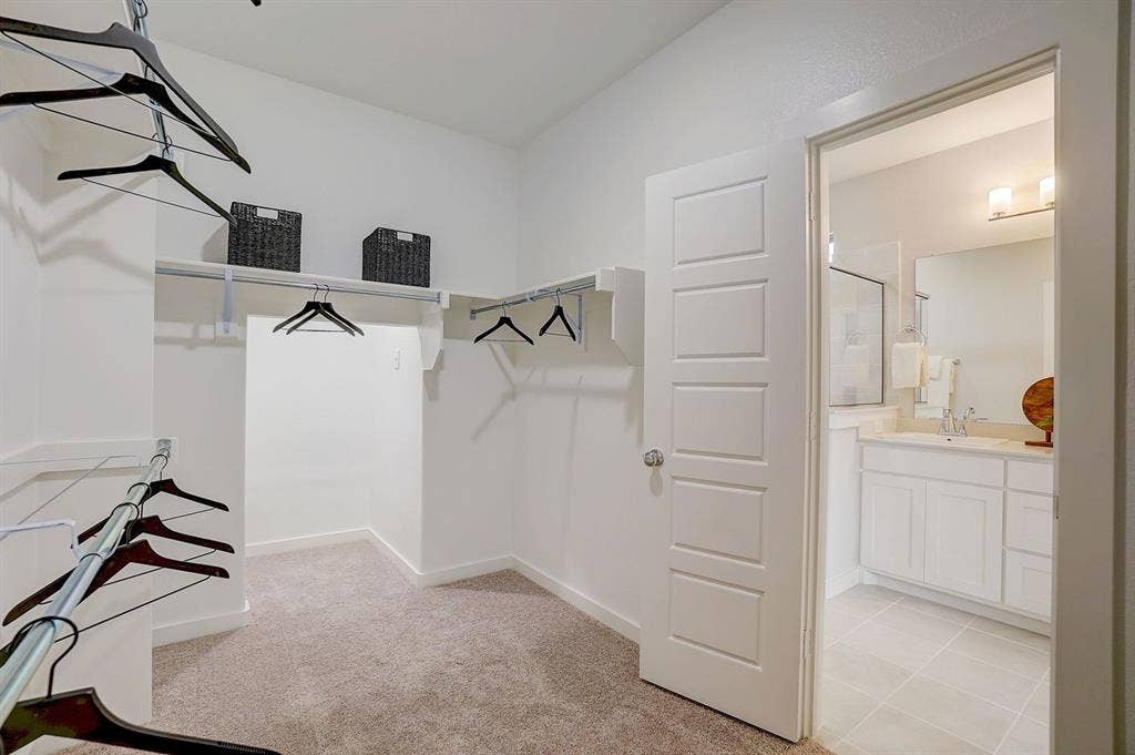 348 Lacy Oak Lane, Waxahachie, TX 75165 Primary Closet in the Stanley II home plan - REPRESENTATIVE PHOTO