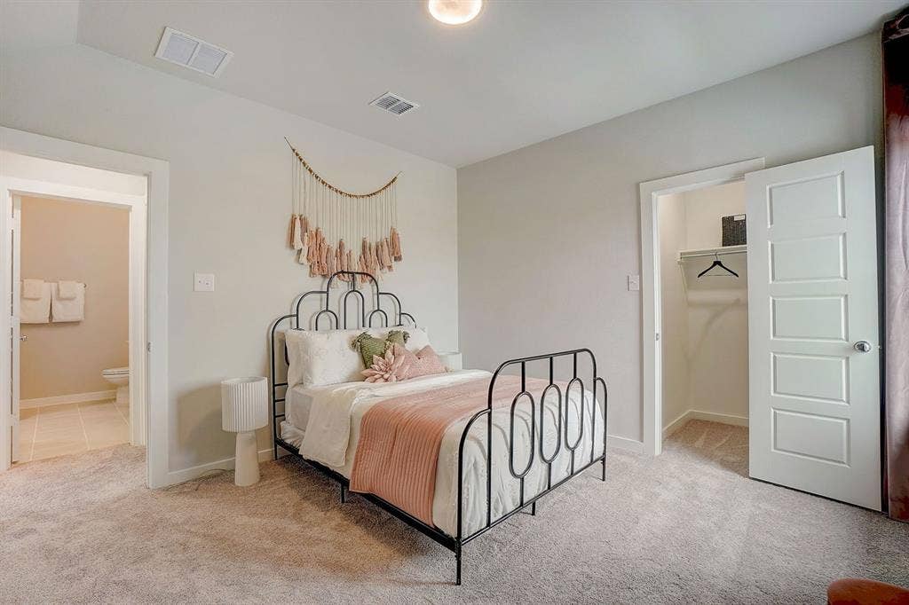 348 Lacy Oak Lane, Waxahachie, TX 75165 Bedroom in the Stanley II home plan - REPRESENTATIVE PHOTO