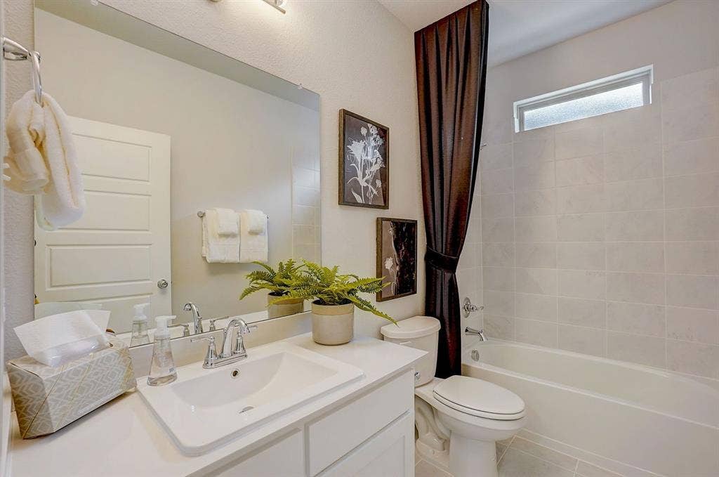 348 Lacy Oak Lane, Waxahachie, TX 75165 Bathroom in the Stanley II home plan - REPRESENTATIVE PHOTO