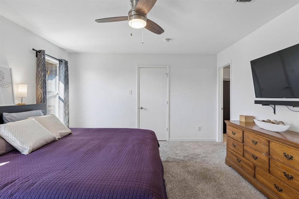Another view of the primary bedroom.
