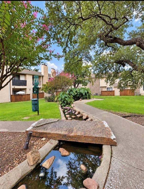 Path leading to Koi pond and another grassy community area.