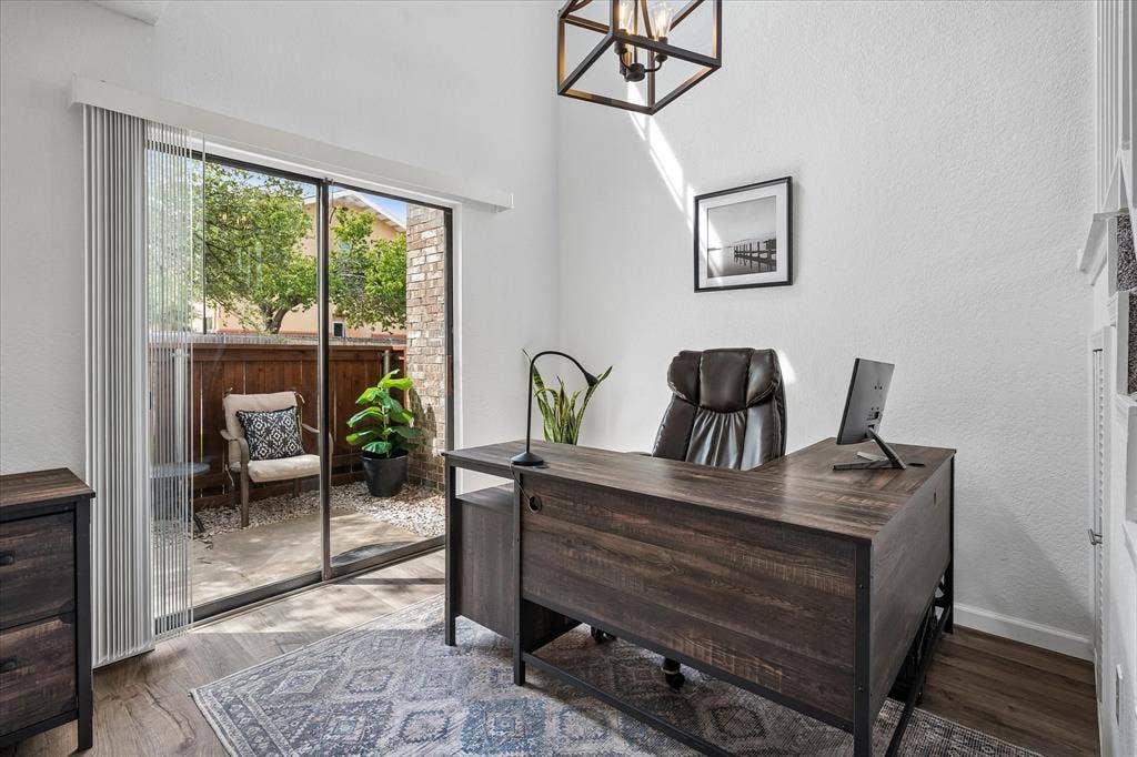 Versatile area that can be used as a study, stay at home office or dining room. Under the stairs to the right is a large closet area. Great access to the outdoors right outside the room make this an enjoyable place to work or eat!