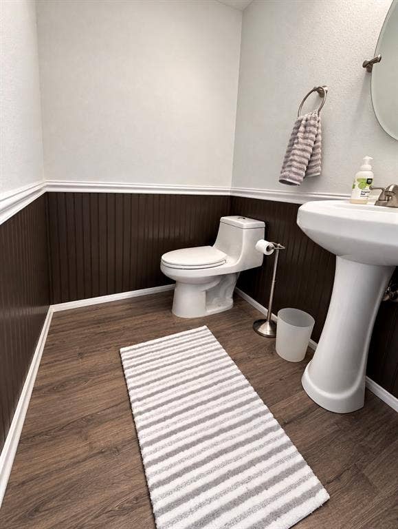 Half bath on 1st floor. Chair rail paneling makes this a great guest bathroom.