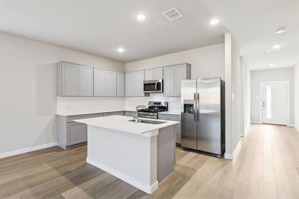 4012 Somerville Drive, Farmersville, TX 75442 Kitchen in the Haylee home plan - REPRESENTATIVE PHOTO