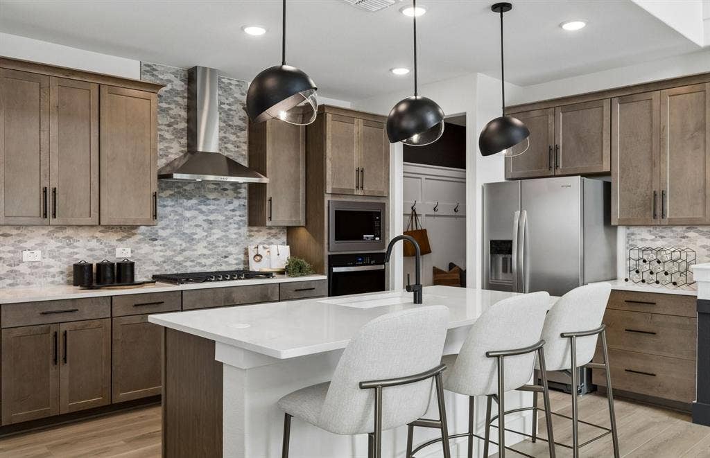 1701 Briarcrest Drive, Celina, TX 75009 *Model Representation - Spacious kitchen with eat-in bartop island