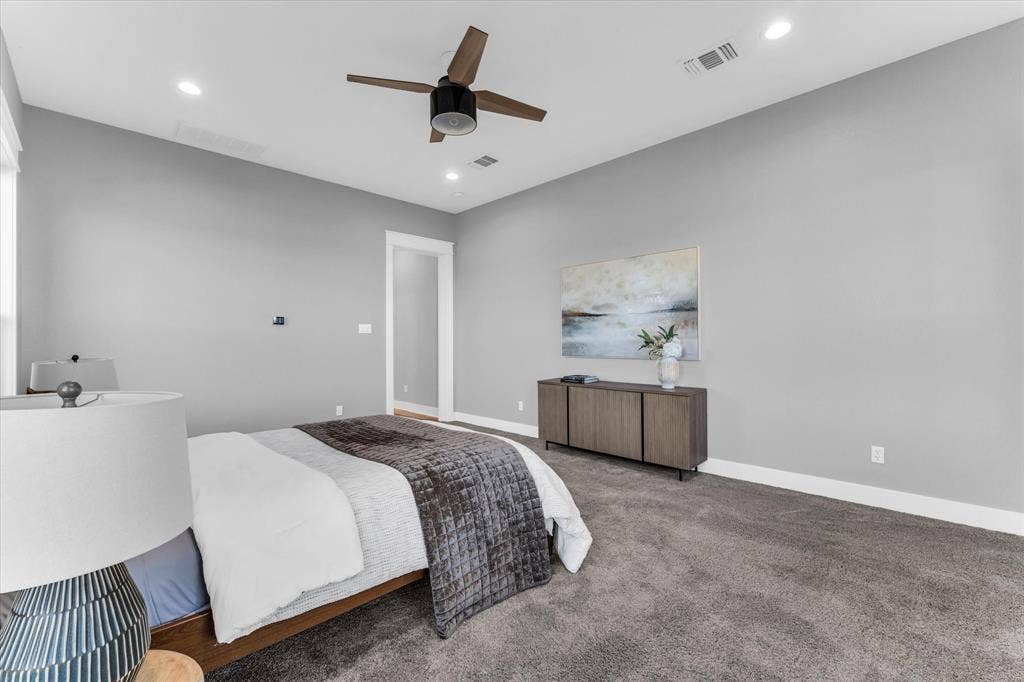 23010 Rosebud Road, Burlington, TX 76519 Neutral-toned interior featuring high ceilings, carpeted flooring, recessed lighting, and a modern ceiling fan