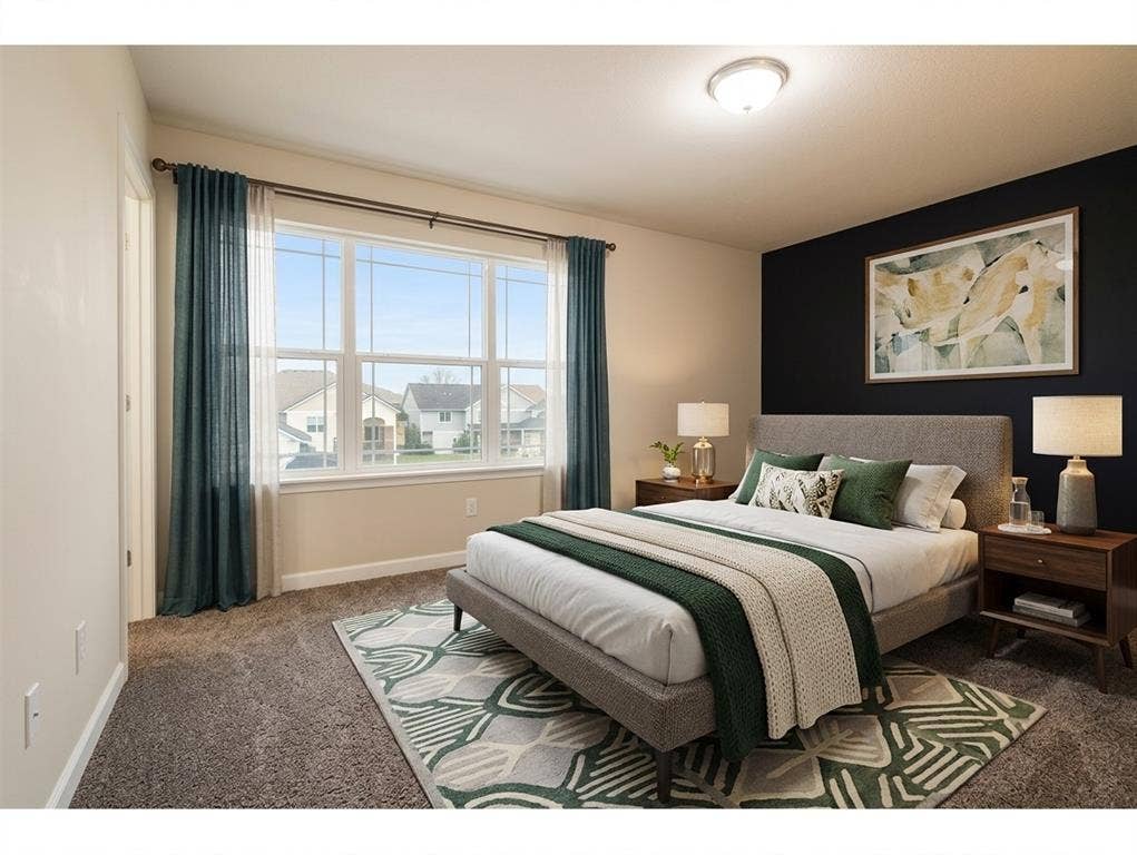 bedroom 2 Neutral-toned room featuring a prominent dark accent wall, plush carpeting, and a large multi-pane window with a center sash