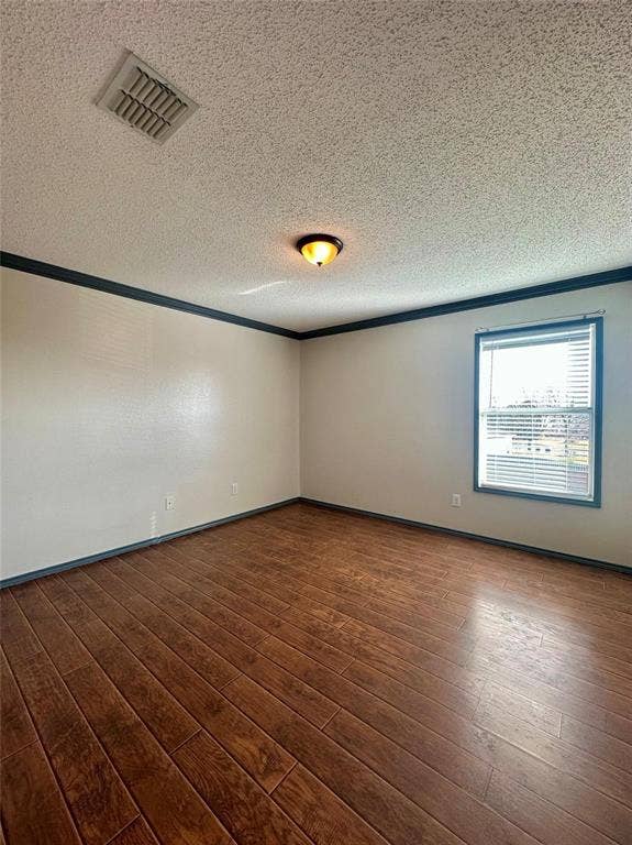 600 Claiborn Lane, Wylie, TX 75098 Interior room featuring wood-finish flooring, neutral wall paint, dark-toned crown molding, a single-window with white blinds, and a flush-mount ceiling light fixture