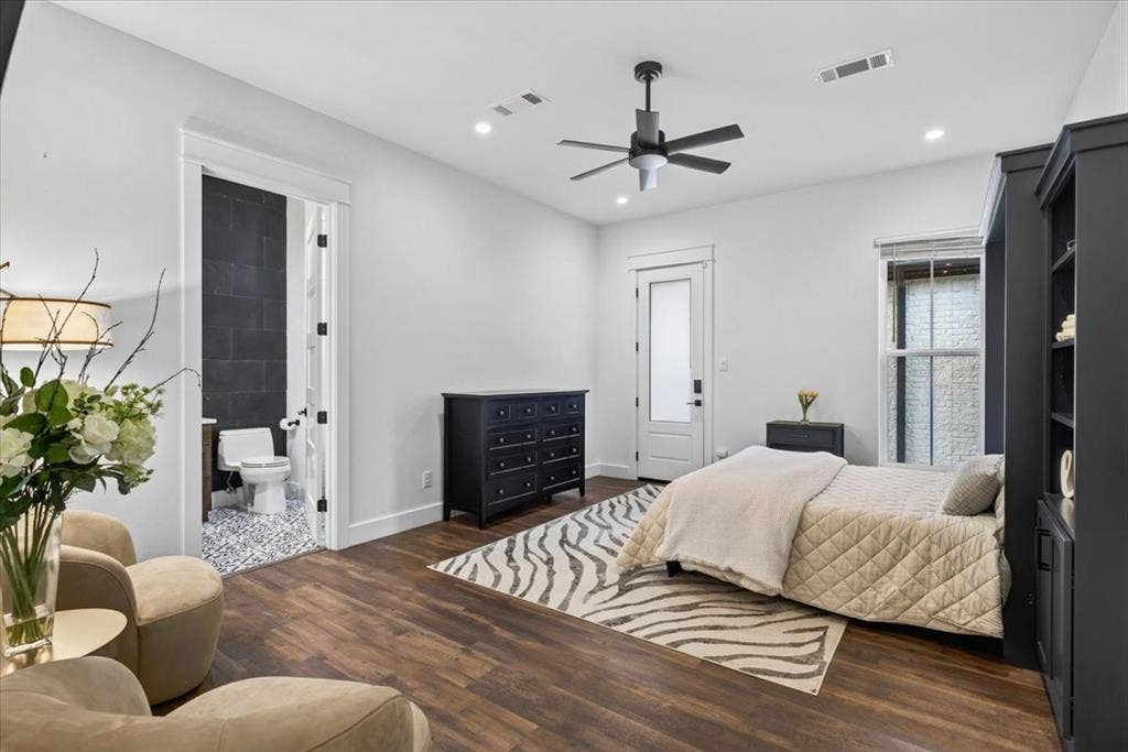 104 Oakbend Trail, Mabank, TX 75147 Bedroom Two features an ensuite bath and built-in Murphy bed, offering flexibility as a guest bedroom or home office, with direct exterior access to the detached garage and gym. Main Residence.