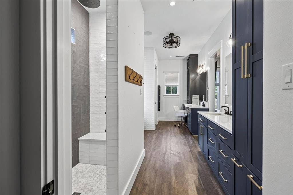 104 Oakbend Trail, Mabank, TX 75147 Primary bathroom featuring a walk-in shower, custom cabinetry, and an extended vanity area. Main Residence.