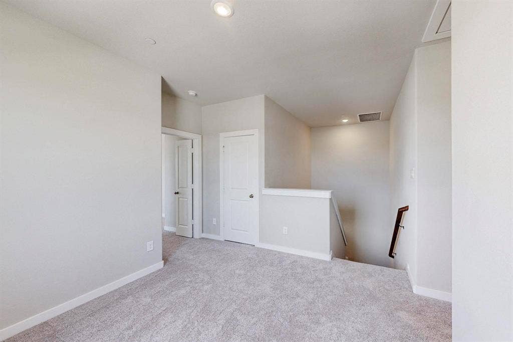 1504 Starlight Trail, Mesquite, TX 75181 Spare room with light carpet and recessed lighting