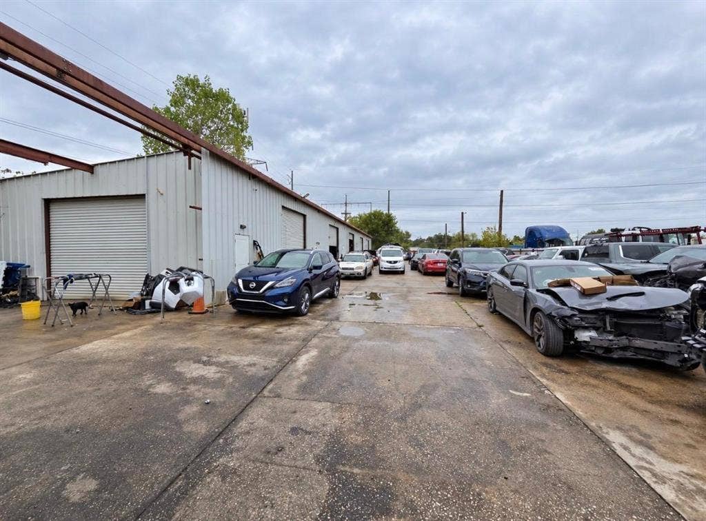 2319 Cartwright Street, Dallas, TX 75212 Industrial metal-sided building with multiple roll-up doors and a concrete exterior lot