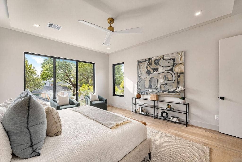 Enjoy a quiet moment with a good book in your bedroom sitting area as morning light fills the space