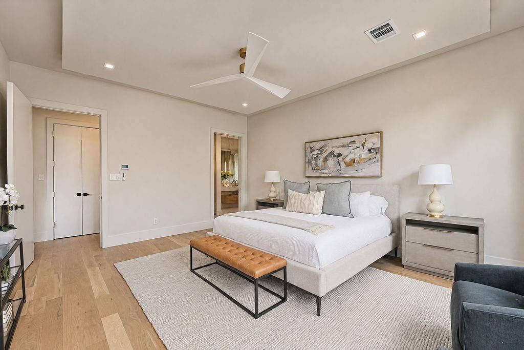 Unwind in an expansive main suite designed for restful nights and slow weekend mornings